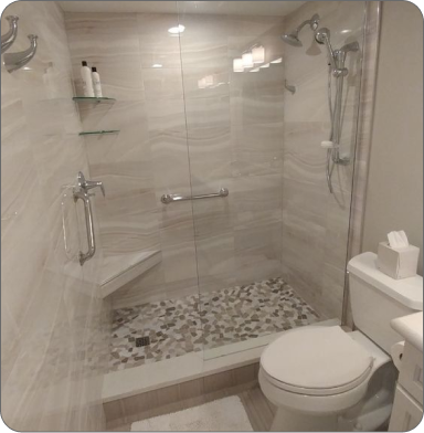 Comfortable office with plants, wooden desk, and two black chairs